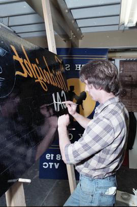 Open House 1986; man painting sign  [2 of 2 photographs]