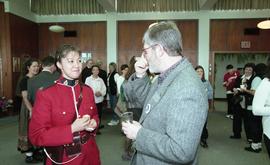 BCIT open house '98, staff member talking with a woman in a RCMP uniform