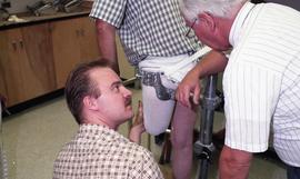 Two people discussing the residual limb they are looking at
