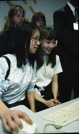 Open House 1998; one girl on computer mouse while both watch computer screen