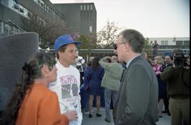 Open House 1992; group of three talking while being filled as part of crowd