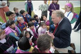 Open house 1992; man on knees speaking to school children [photograph 2 of 5]