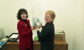 Two female staff members holding a gift basket [5 of 5 photographs]