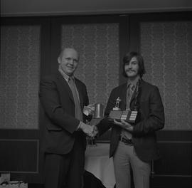 Hockey presentation, Plaza 500, 1972; player receiving a trophy [2 of 2]