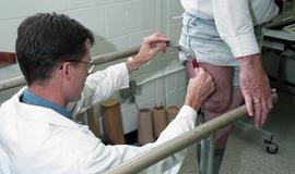 Man examining residual limb [6 of 7 photographs]