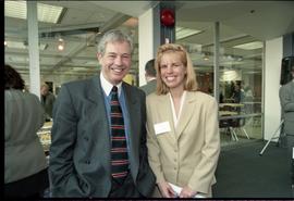 Open House 1998; man and women in suits smiling at camera