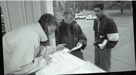 Communications Relations Opening Day 1991;  student getting help at student information kiosk [ph...