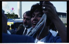 Open House 1992; man looking thoughtful in background with cheering woman in foreground