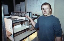 Open House 1992; man pointing at architecture project  [photograph 3 of 3]