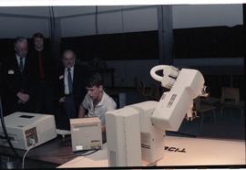 Open House 1986; man demonstrating medical equipment to guests