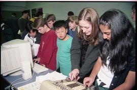 Open House 1998; students examining electronics and computer [photograph 1 of 2]