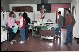 Open House 1986; medical display  observed by guests with medical dummies