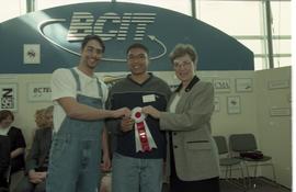 Open House 1998; two students standing with woman in suit holding 2nd prize ribbon [photograph 1 ...