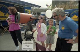 Open house 1992; child using Schmidt–Cassegrain telescope [photograph 2 of 2]