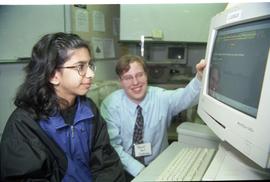 Open House 1998; man watching girl use computer [photograph 2 of 3]