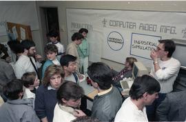 Open House 1986; group milling in front of materials management display