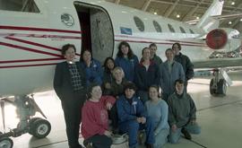 BCIT women in trades; aviation, group shot of students in front of an airplane inside a hangar [9...