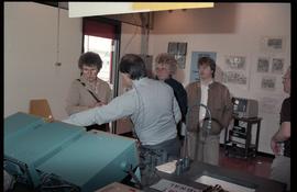 Open House 1986; man explaining machines to public