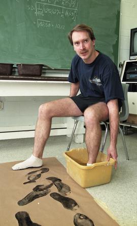 Man with foot in tub of water