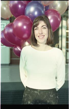 Open house 1995; woman  smiling in front of balloons [photograph 3 of 4]