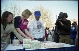 Open House 1992; two women and one man cutting cake while filmed