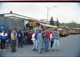 Open house 1992; students milling in front of school buses