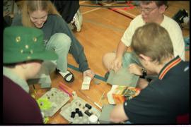 Open House 1998; high school students grouped together around egg cartons
