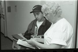 Communications Relations Opening Day 1991;  student interacting with older woman in orientation s...