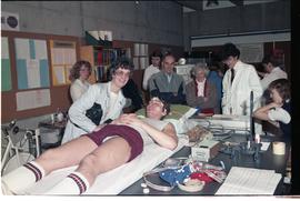 Open House 1986; student wearing EEG monitor for guests