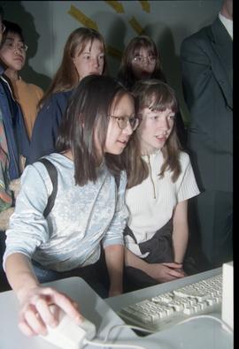 Open House 1998; two girls in front of computer, one using computer mouse [photograph 1 of 3]