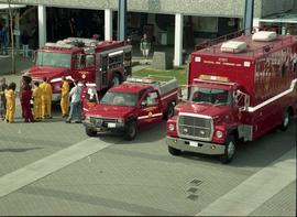 Open House 1998; above view of fire trucks and crowd in fire resistant overalls with Smokey the Bear