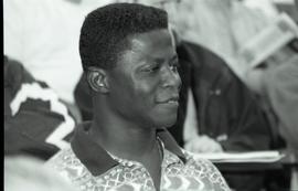Communications Relations Opening Day 1991; closeup of man listening with smile
