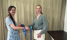 Pair of students posing with prosthetics [3 of 5 photographs]