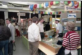 Open House 1986; group viewing various transport and business displays