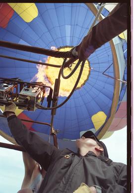 Open house 1992; man pulling lever in hot air balloon [photograph 1 of 3]