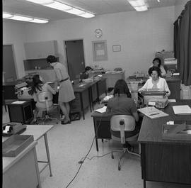 BC Vocational School Commercial Program; students typing ; student talking to instructor