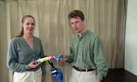 Pair of students posing with prosthetics [4 of 5 photographs]