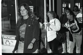Communications Relations Opening Day 1991; people walking through glass doors [photograph 1 of 3]