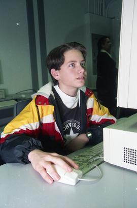 Open House 1998; boy staring up at computer [photograph 2 of 2]