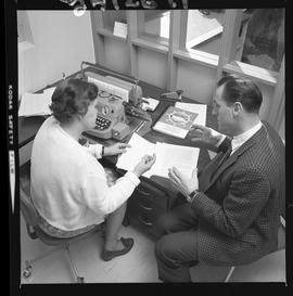 BCVS Graphic arts ; two people sitting at a desk and looking at paperwork [4 of 4]