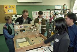 Open House 1998; students gathered around man and Western Supplies thermostat display [photograph...