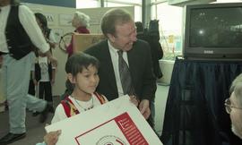 BCIT open house '98, First Nations youth holding a poster that reads "First Nations Programs...