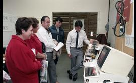 Open House 1986; group viewing CND printing machine [photograph 1 of 2]