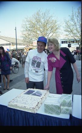 Open House 1992; man and woman cutting cake [photograph 2 of 2]