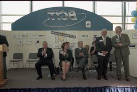Open House 1998; woman and men applauding three standing men on Open House BCIT stage [photograph...