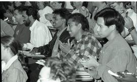 Communications Relations Opening Day 1991; young men in lecture seats applauding