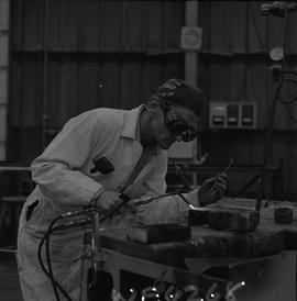 Welding, 1968; man wearing protective goggles welding [5 of 6]