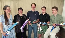 Prosthetics/Orthotics student group photo, posing with prosthetics [3 of 4 photographs]