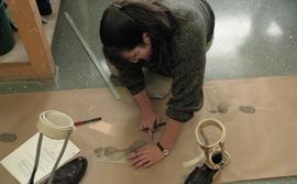 People measuring ink footprints [9 of 10 photographs]