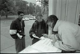 Communications Relations Opening Day 1991;  student getting help at student information kiosk [ph...